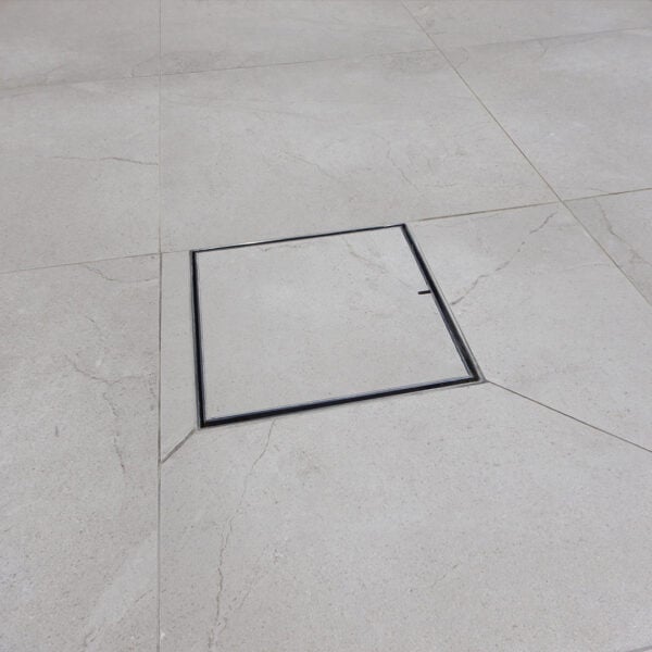 HIDE stainless steel Drain Cover with grey tile inlay.