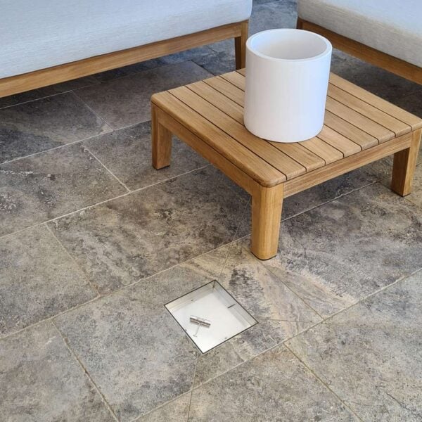 HIDE Stainless Steel Drain Cover in tile before tile inlay has been added. Showing the Stainless Steel hardware.