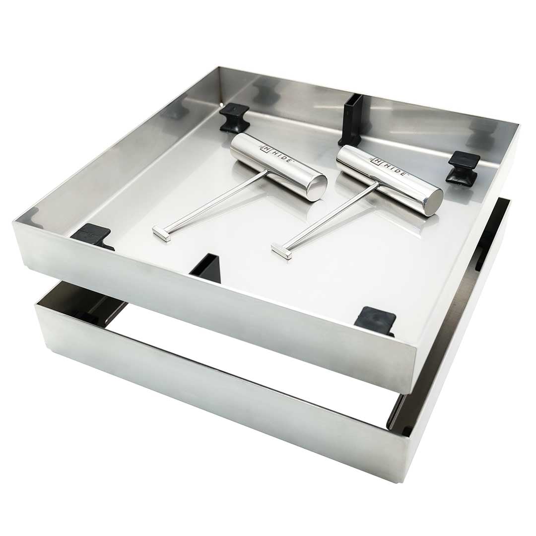 HIDE Concrete Cover raw hardware, showcasing the frame, lid with black concrete lugs and two HIDE safety keys.