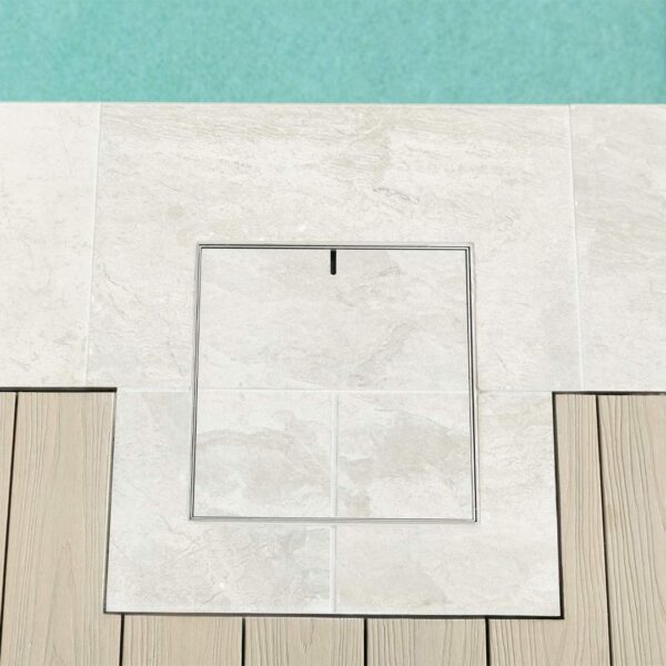 HIDE Skimmer Cover with tile pattern inlay next to pool.