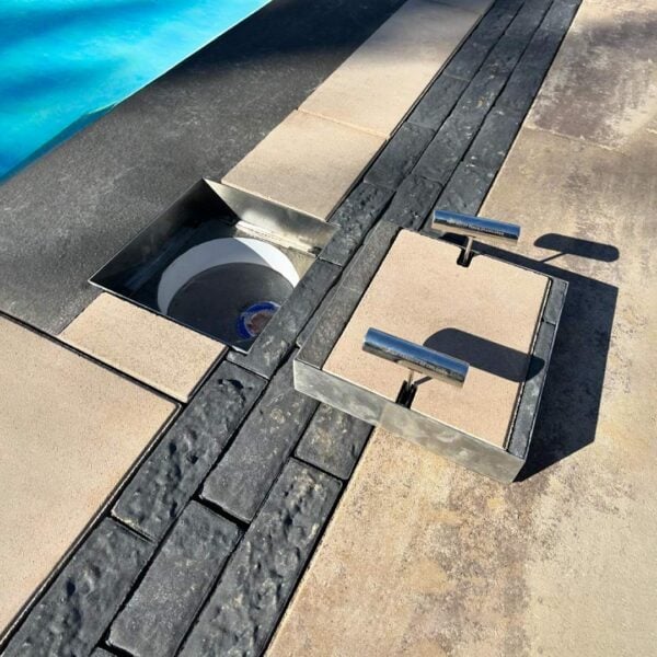 HIDE Skimmer Cover with thick paving inlay next to pool.