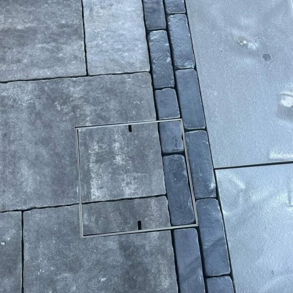 HIDE Access Cover with grey paving pattern inlay.