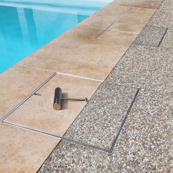 HIDE Skimmer Cover with dual tile and expose aggregate concrete inlay.