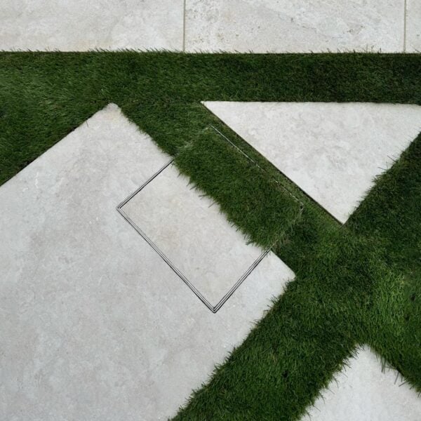 HIDE Access Cover with artificial turf and concrete paving inlay.