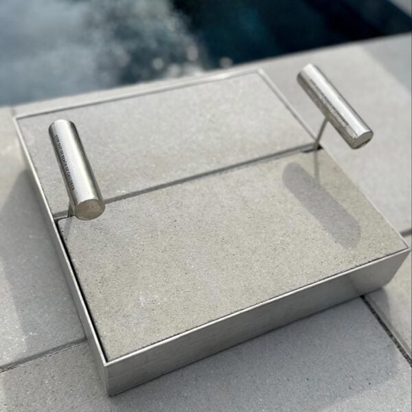 HIDE Skimmer Cover with thick paving inlay. Two keys in the keyholes for easy lifting.