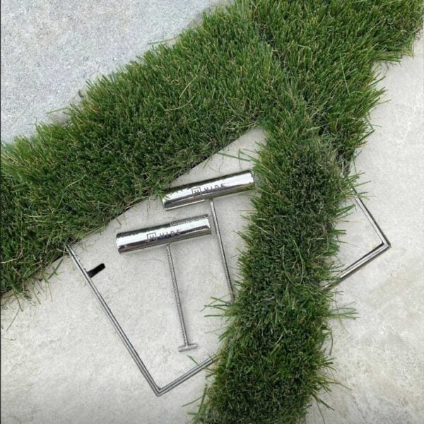 HIDE Access Cover with artificial turf and concrete paving inlay; continuing poolside coping pattern to create a seamless hardscape.