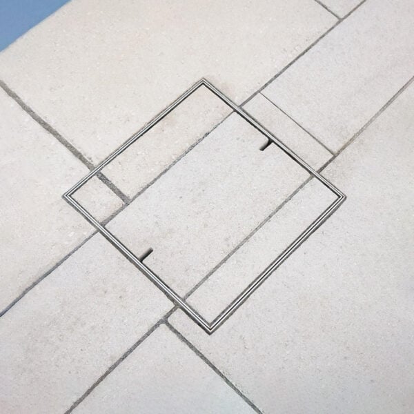 HIDE Skimmer Cover with paving inlay and paving pattern running through to create a sleek seamless finish.