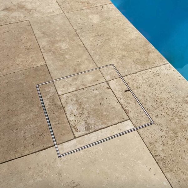 Stainless Steel HIDE Skimmer Cover with stone inlay; stone pattern running through the cover to create a seamless finish.