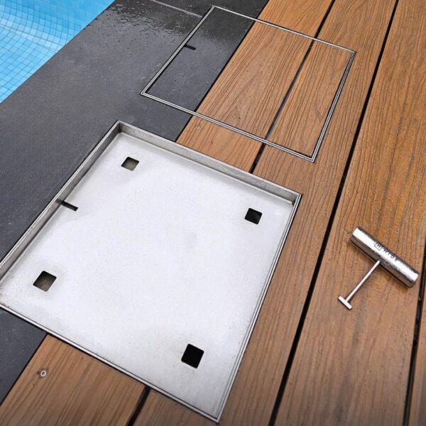 HIDE stainless steel Skimmer Covers installed into timber decking, showing frame, lid underside, and lifting key for on-site inlay installation.