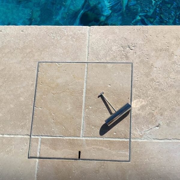HIDE Skimmer Cover with cream tile inlay and HIDE safety key.