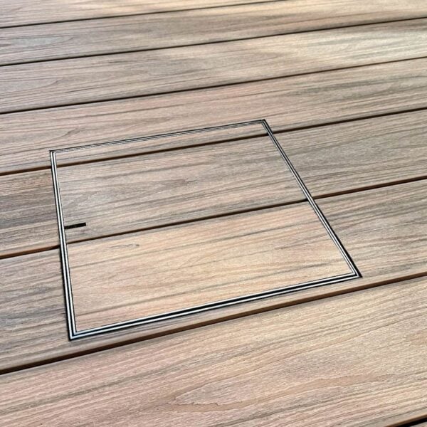 Stainless Steel HIDE Access Cover with timber decking inlay, timber grain running through cover to create a completely seamless look.
