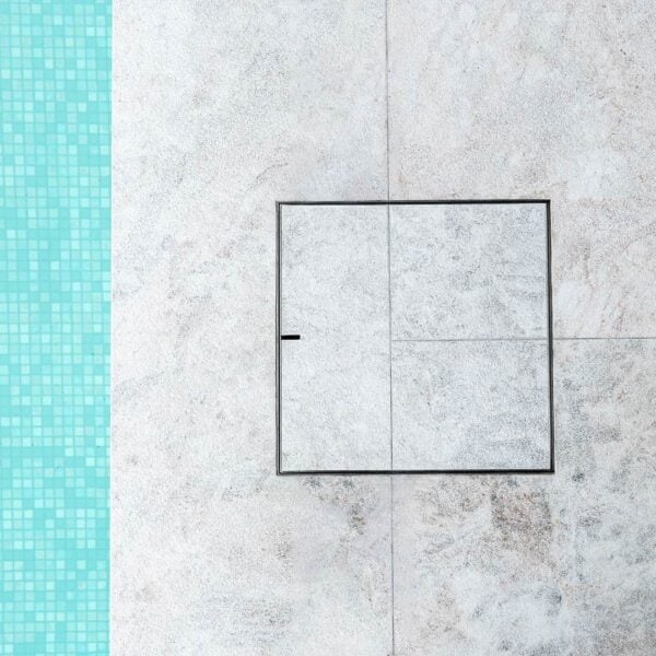 HIDE Stainless Steel Skimmer Cover with grey tile inlay.