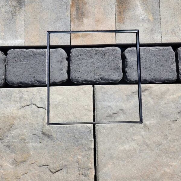 HIDE Access Cover with intricate paving inlay. Paving pattern runs through the HIDE Cover to create a seamless finish.