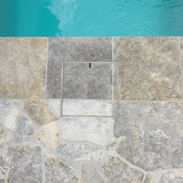 HIDE Skimmer Cover with grey tile and crazy pave inlay installed next to pool.