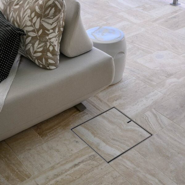 HIDE Exterior Cover with limestone coloured tile inlay under outdoor patio area.